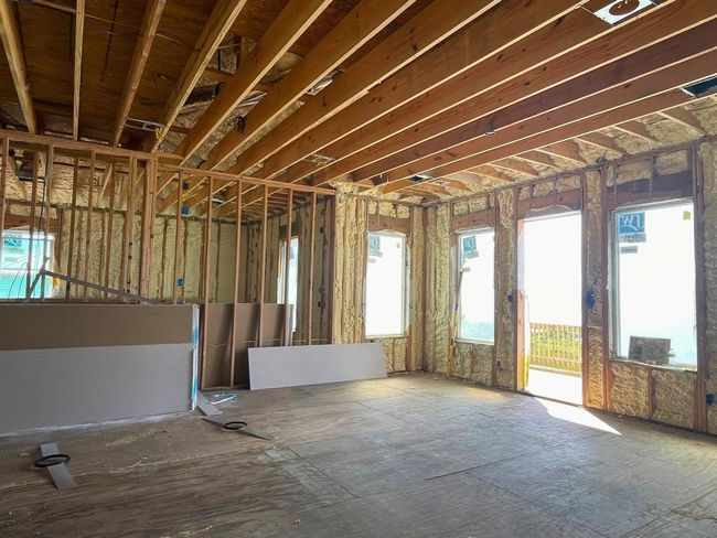 Construction is king — shown here at the framed stage, you’ll see what sets Seahorse Estates apart: 2"x6" exterior studs, trusses between floors for added stability, and full spray foam insulation in the walls, roof, and subfloor. Built for longevity, efficiency, and long-term return on investment. | Image 29