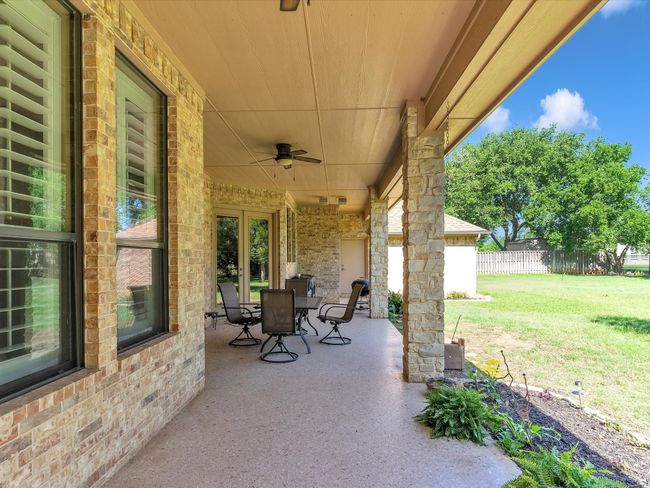 View of patio / terrace featuring a ceiling fan and outdoor dining area | Image 31