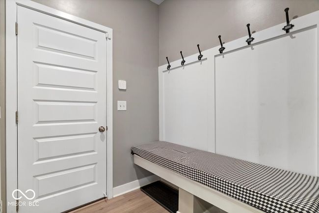 mudroom with light wood-style floors and baseboards | Image 21