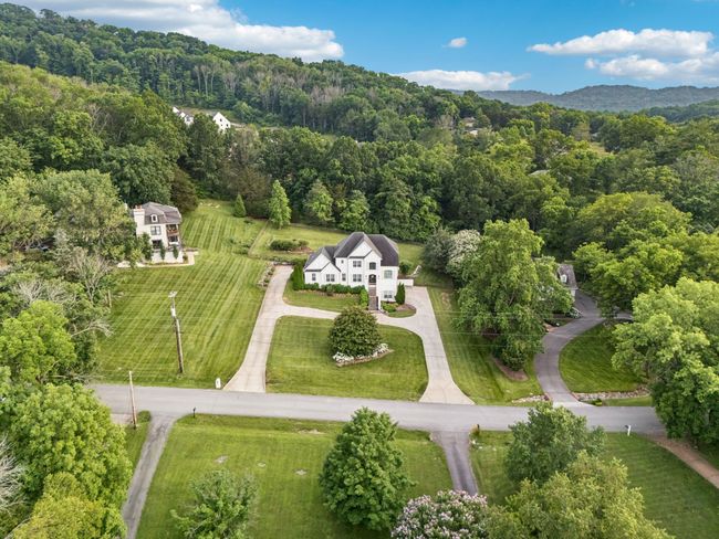 Sprawling one-acre lot nestled among trees with plenty of privacy and space. | Image 4