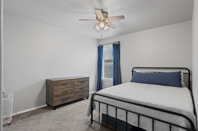 Bedroom with carpet floors and ceiling fan | Image 8