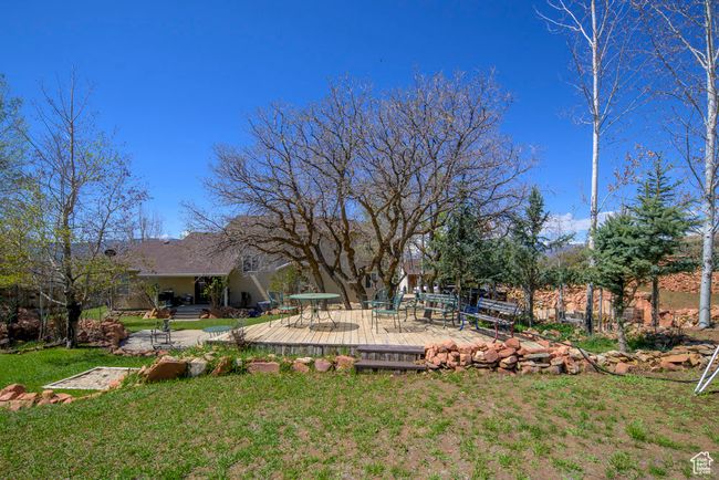 View of yard featuring a deck | Image 69