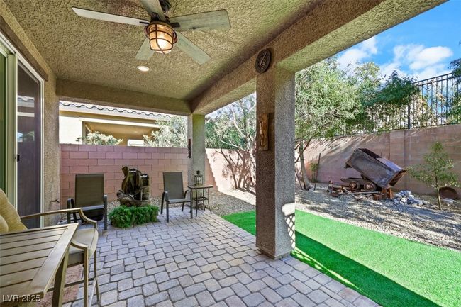 View of patio / terrace with a fenced backyard and ceiling fan | Image 39
