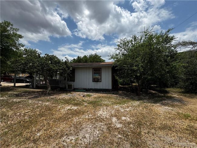View of home's exterior with central AC | Image 5
