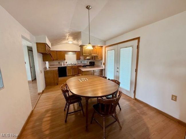 Unfurnished bedroom featuring multiple closets and wood finished floors | Image 11