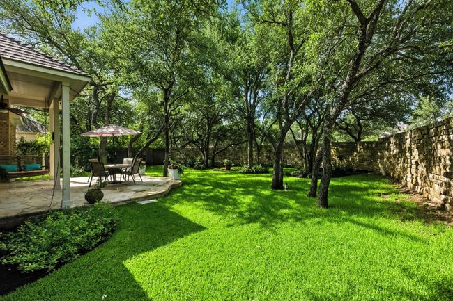 Fenced backyard featuring a patio | Image 32