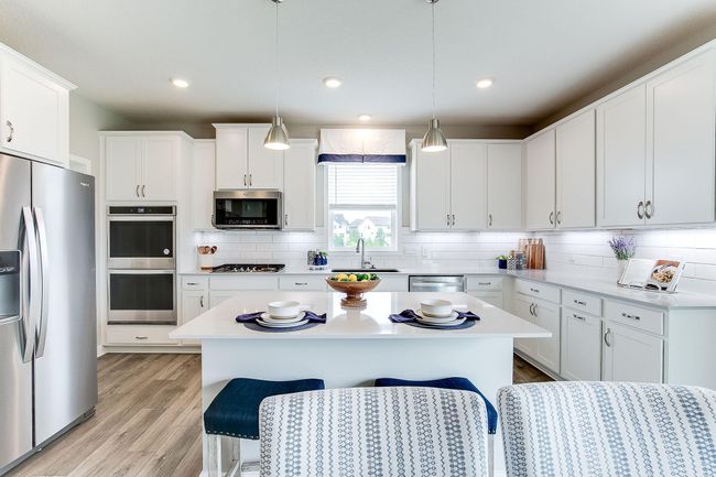 This space will make meal preparation a pleasure not a task. Take note of the double-wall ovens!!! Photo of model home, color & options may vary. | Image 4