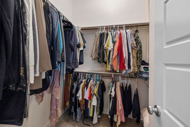Spacious closet with carpet | Image 21