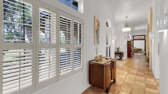 Entry Foyer has a path to the East and West bedroom while leading directly to the main Family Room | Image 5