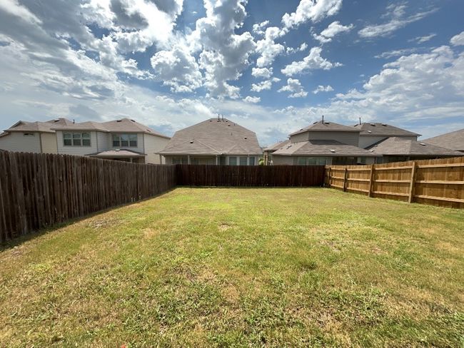 Fenced backyard featuring a residential view | Image 23