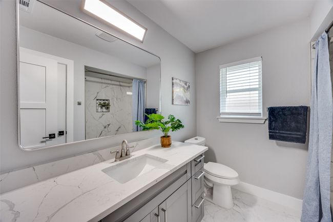 Bathroom with marble finish flooring, vanity, and a marble finish shower | Image 29
