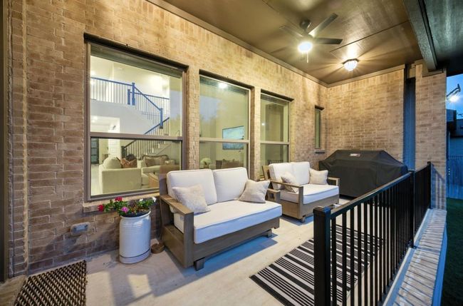 View of patio / terrace with an outdoor living space, ceiling fan, a grill, and stairway | Image 39
