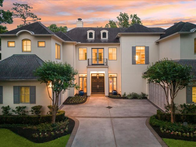 Located at the end of a secluded gated drive, this spectacular home blends French style with modern tastes seamlessly with a stunning forested backdrop. | Image 5