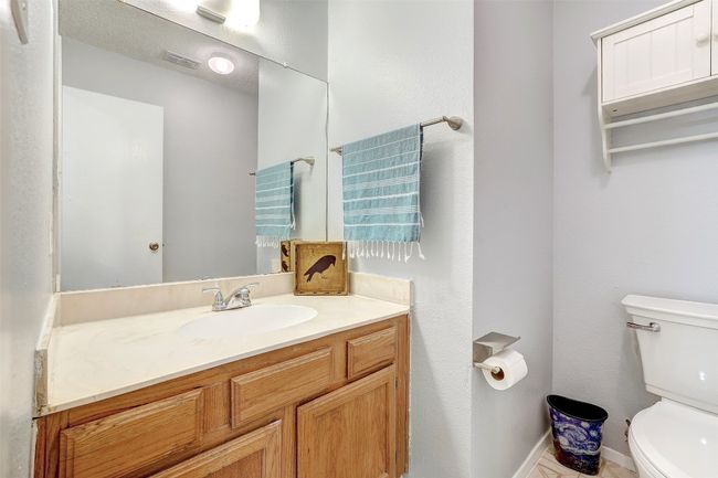 Bathroom with toilet, vanity, and baseboards | Image 14