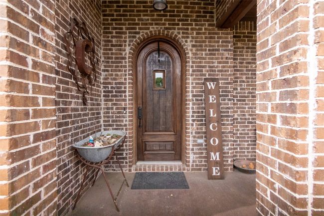 Property entrance with brick siding | Image 5