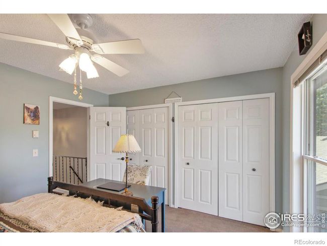 The guest room also has plenty of closet space with organized storage solutions. | Image 15