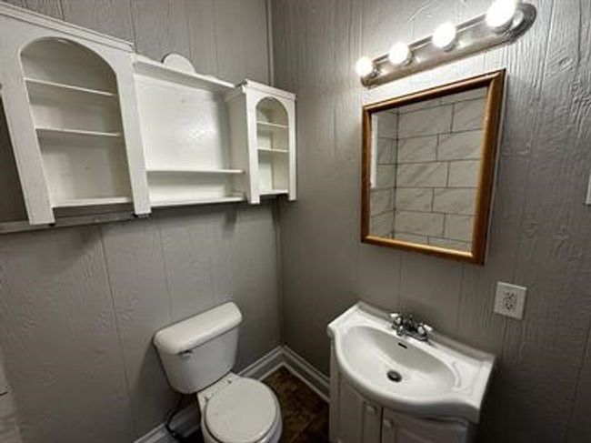 Bathroom featuring toilet and vanity | Image 10