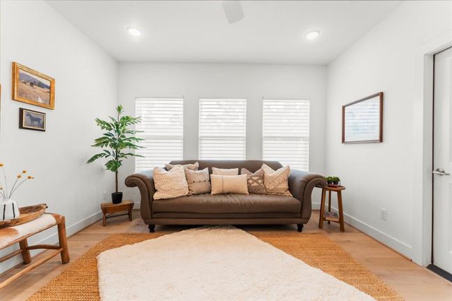 Upstairs gameroom space with walk-in attic storage. | Image 35