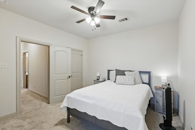 Bedroom with carpet and ceiling fan | Image 24