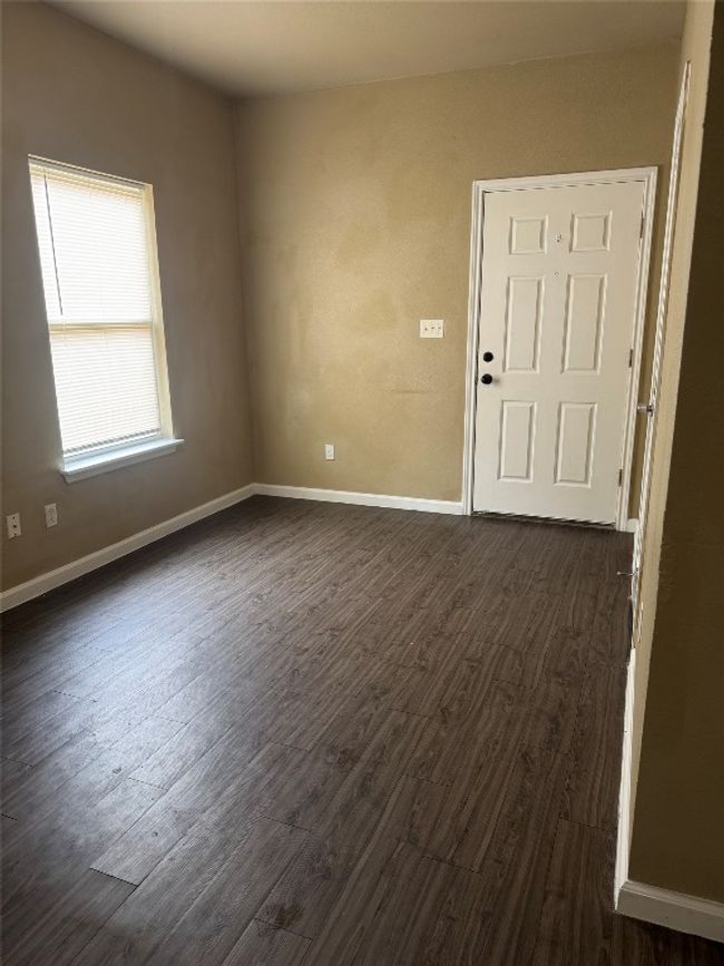 Unfurnished room with dark wood finished floors | Image 4