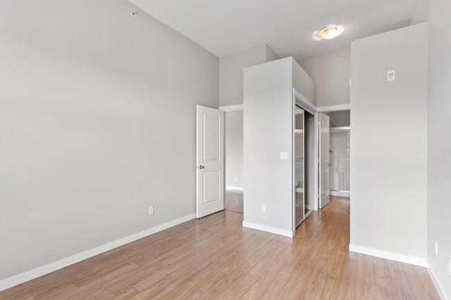 Unfurnished bedroom with baseboards, a closet, and light wood finished floors | Image 22