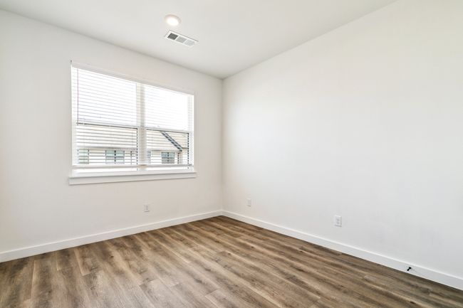 Empty room with wood finished floors and baseboards | Image 29