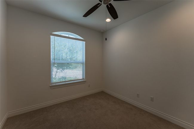 Carpeted spare room with plenty of natural light, a ceiling fan, and recessed lighting | Image 8