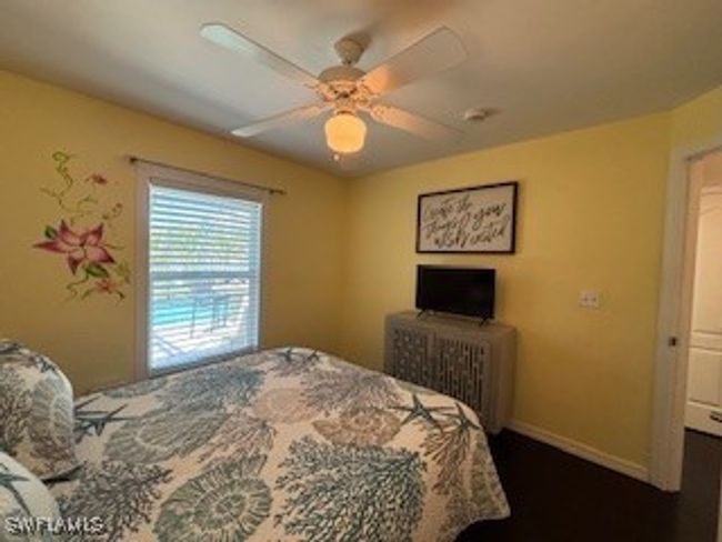 Bedroom featuring baseboards and ceiling fan | Image 25