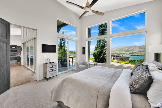 Carpeted bedroom with high vaulted ceiling, access to exterior, and ceiling fan | Image 28