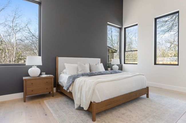Bedroom featuring baseboards and light wood-style flooring | Image 24
