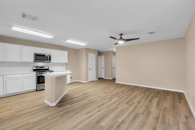 Incredible kitchen is open to breakfast area and formal dinning room | Image 13