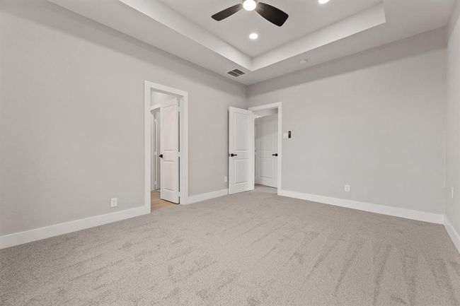 Another view of the primary bedroom, leading into the primary bathroom. | Image 21