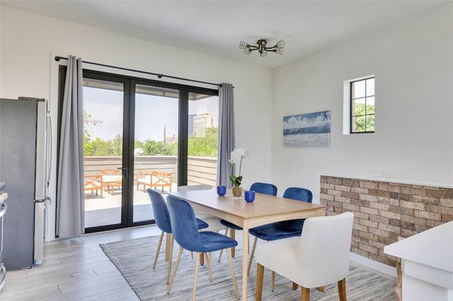 Dining area featuring light wood-type flooring and french doors | Image 19