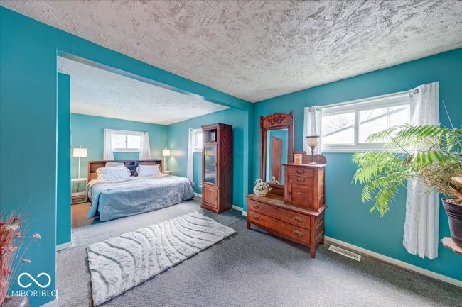 Master bedroom remodeled with fresh paint and great natural lighting | Image 24