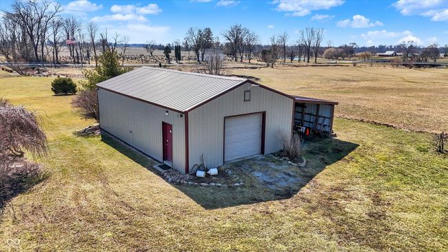 This barn has a half bath, workbench and lean to for extra storage. | Image 53
