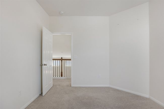Spare room featuring baseboards and light colored carpet | Image 19