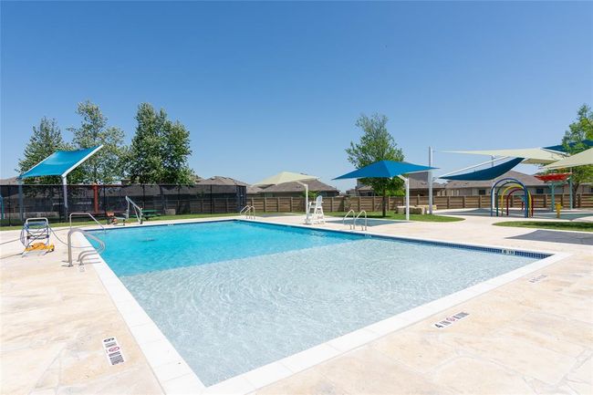 Community pool with a patio and fence | Image 26