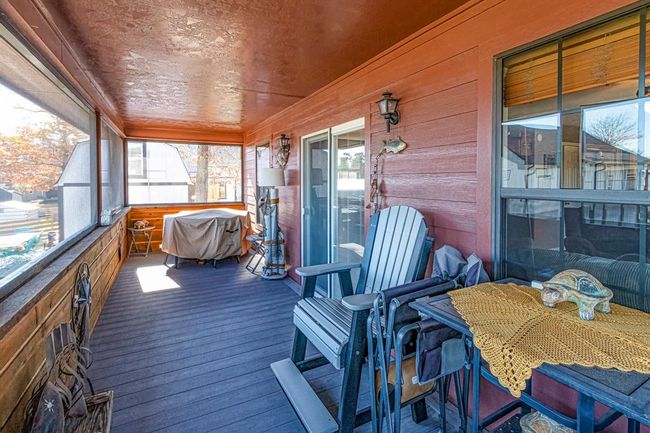 Folks, this is the honey pot! You can begin each day with a cuppa Joe on this screened-in porch and end it with some vino. What a pretty view from a lovely porch! | Image 25