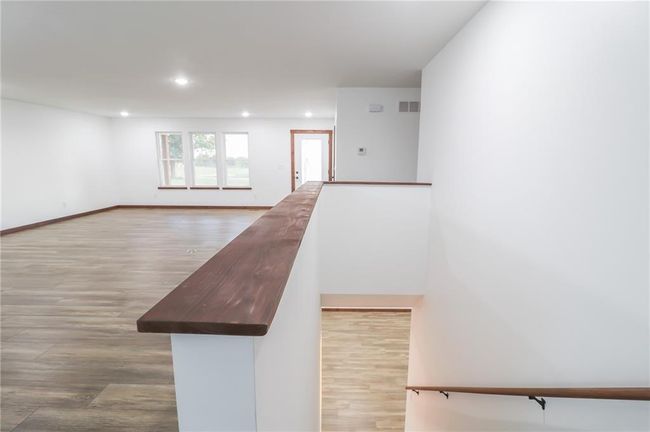 Staircase featuring wood-type flooring | Image 19