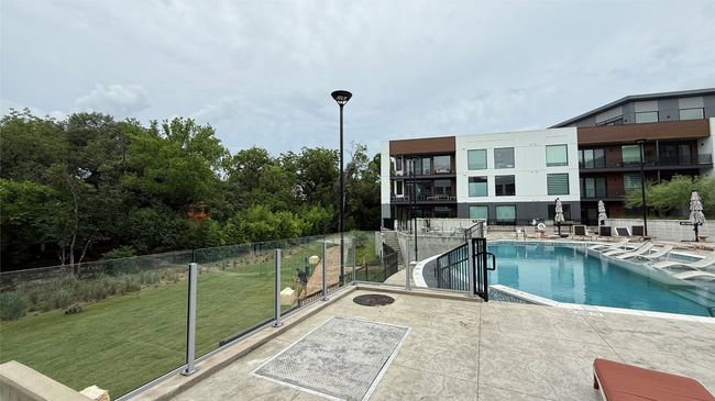 Community pool with a patio area | Image 25