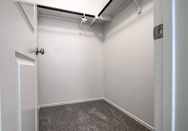 Walk in closet with carpet floors | Image 23