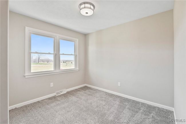 Carpeted spare room with baseboards and visible vents | Image 21