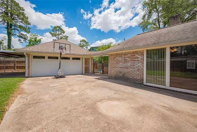 Large picture windows to the breakfast room offer a wonderful view to the fenced backyard area. | Image 43
