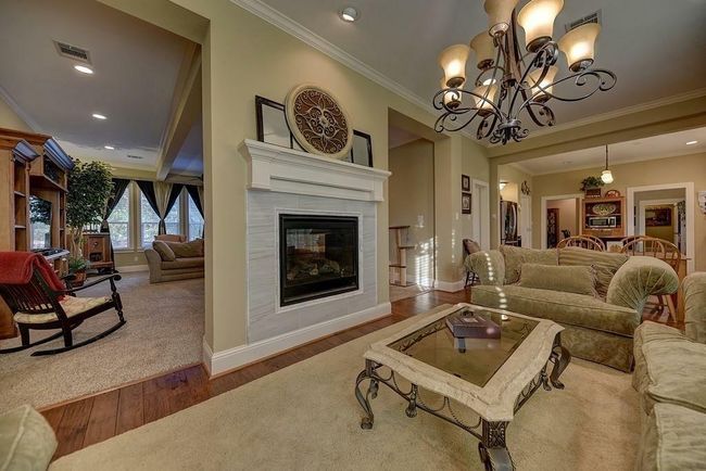 Currently used as a sitting room, there is ample room for a large table. | Image 12