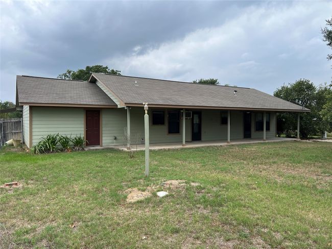 Rear view of house featuring a patio and a lawn | Image 21