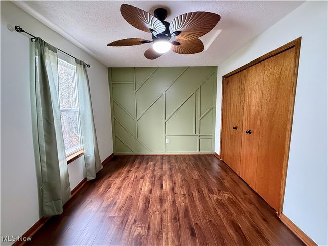 updated bedroom with accent wall | Image 26