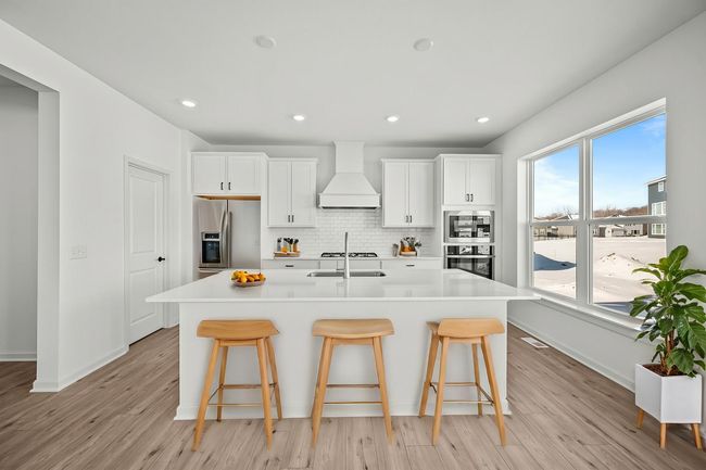 Oversized windows and 9' ceilings create a bright, happy space. | Image 6
