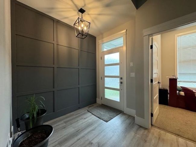 Entrance foyer featuring plenty of natural light, baseboards, and light wood-type flooring | Image 15