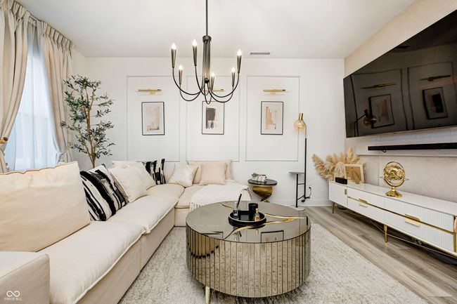 living area featuring an inviting chandelier, wood finished floors, and visible vents | Image 6