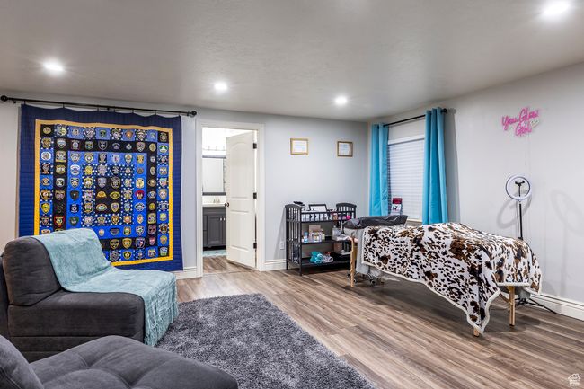 Bedroom with ensuite bath and light hardwood / wood-style floors | Image 39